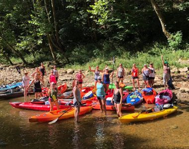Group kayaking on Buck Creek in Pulaski County, Kentucky