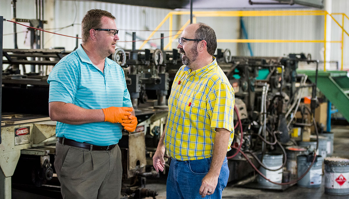 Two employees in discussion at Somerset Hardwood Flooring in Somerset-Pulaski County, Kentucky