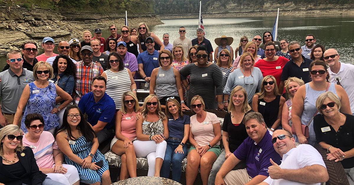Large group of people pose for photo on houseboat on Lake Cumberland