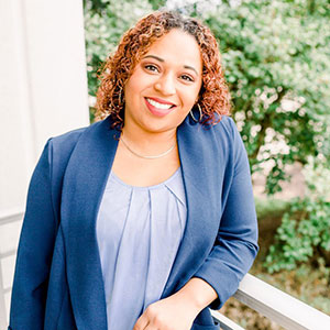 woman smiling and leaning on rail