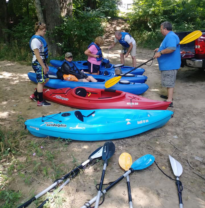 people in kayaks