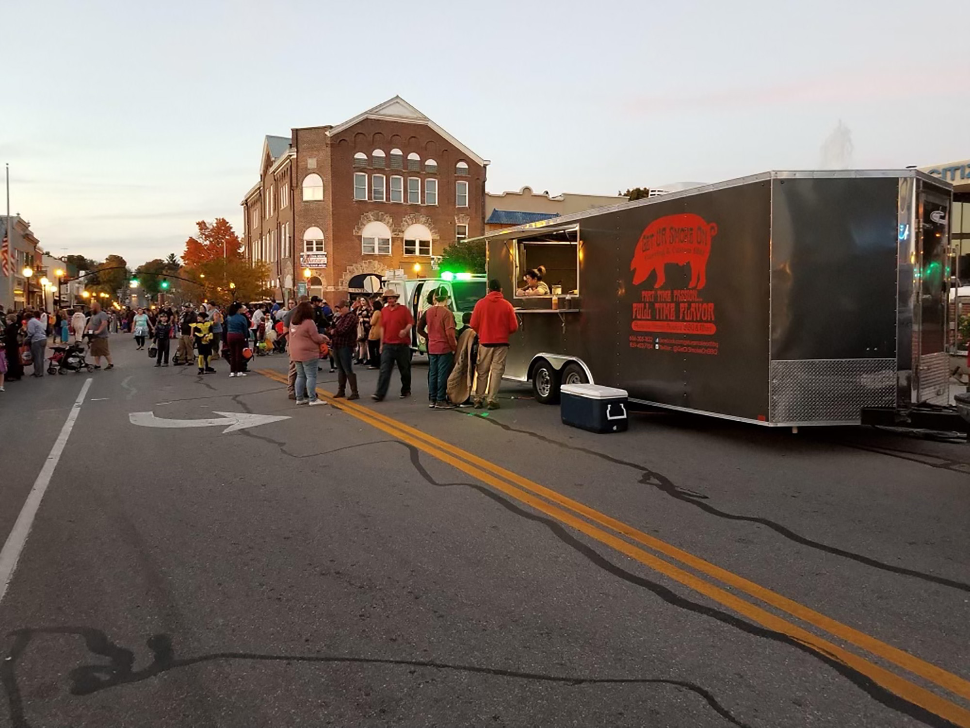 people standing in line at food truck