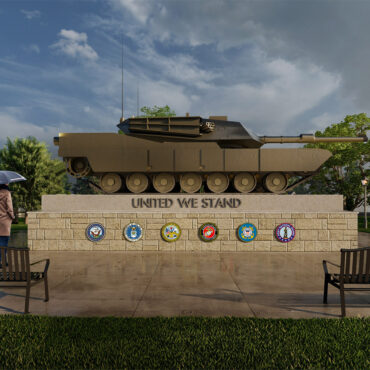 military tank displayed in a park setting