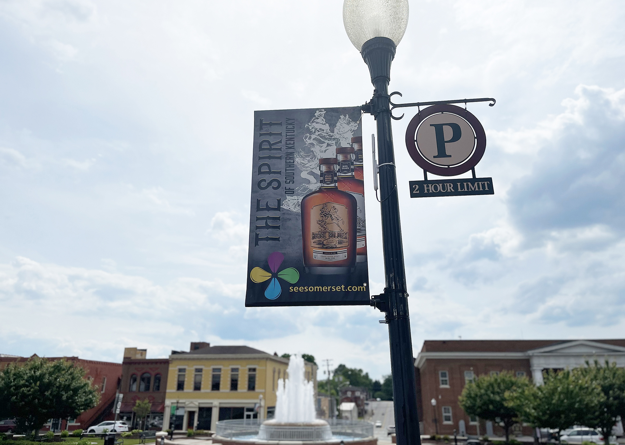 banner on light pole that reads The Spirit of Southern Kentucky with a photo of a Horse Soldier Bourbon bottle