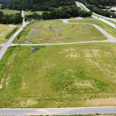 Aerial photo of development next to four-lane highway