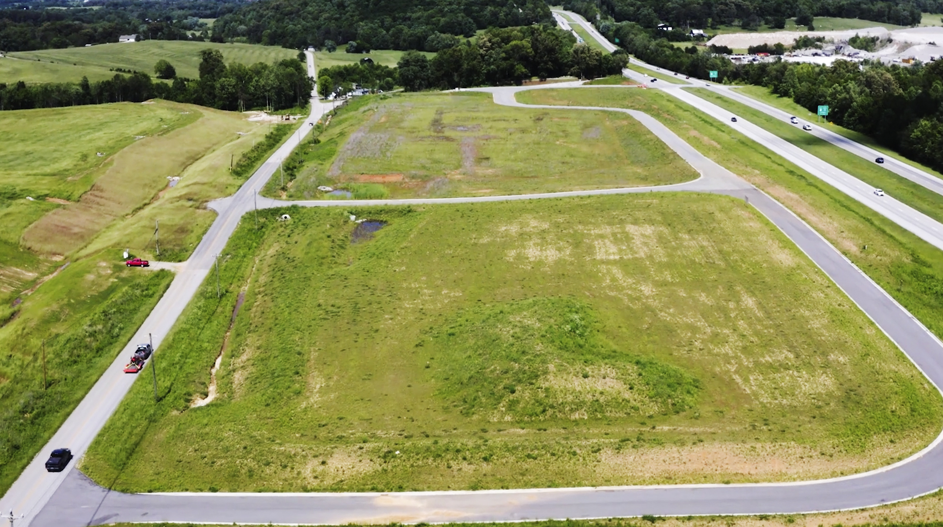 Aerial photo of development next to four-lane highway